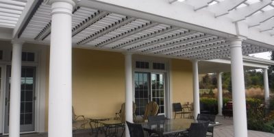 White louvered pergola with roof
