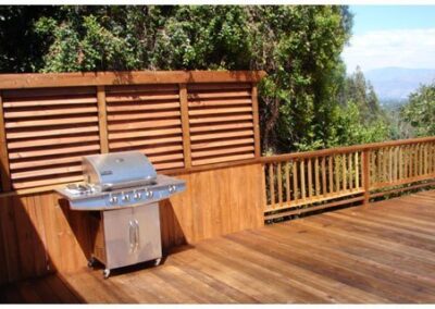 Privacy deck railing used for BBQ enclosure